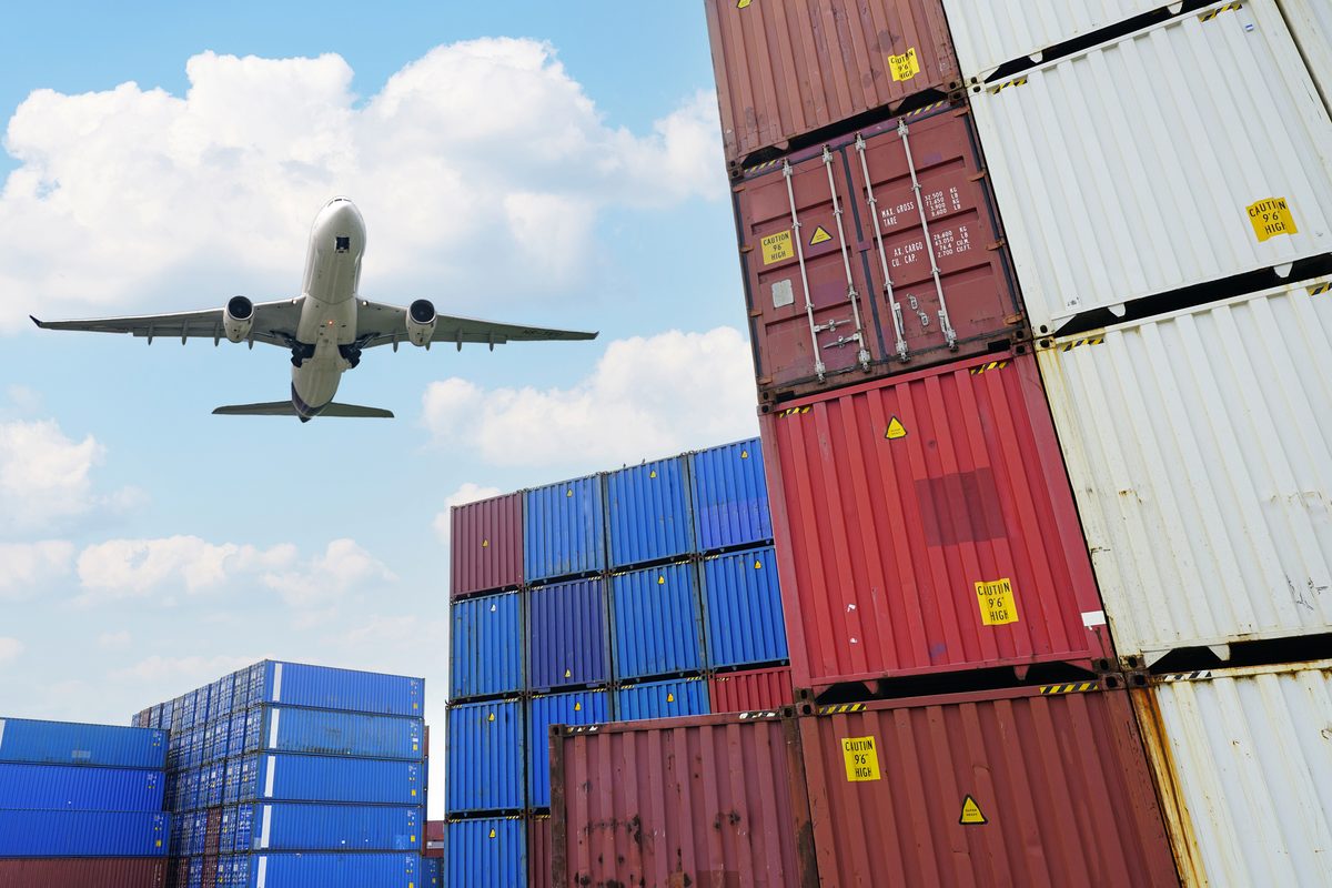 Air freight and shipping containers at an international logistics hub